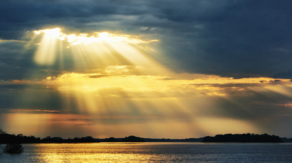 A heaven rays of sunshine on river